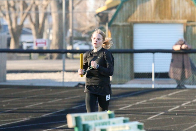 A Woodward-Granger runner competes during the Cavanaugh Relays on Thursday, April 4, 2024, at Hawk Stadium in Woodward.