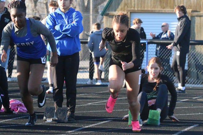 Perry and Woodward-Granger runners compete during the Cavanaugh Relays on Thursday, April 4, 2024, at Hawk Stadium in Woodward.