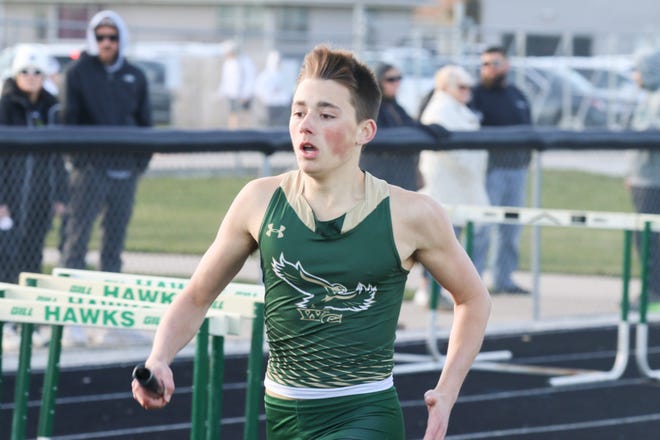 A Woodward-Granger runner competes during the Cavanaugh Relays on Thursday, April 4, 2024, at Hawk Stadium in Woodward.