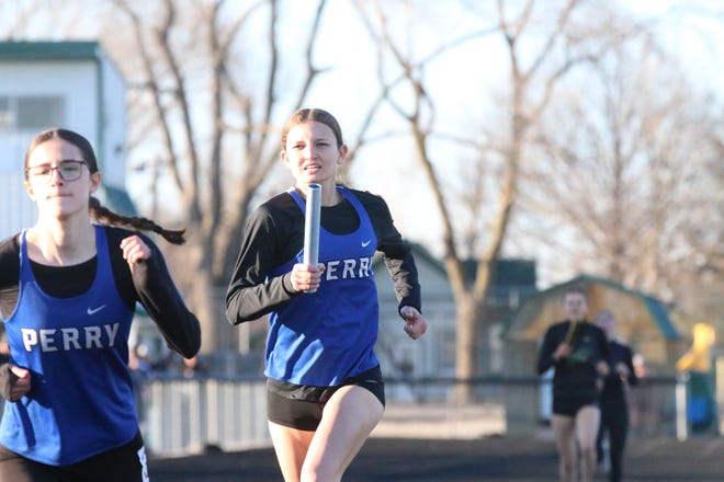 A Perry runner competes during the Cavanaugh Relays on Thursday, April 4, 2024, at Hawk Stadium in Woodward.