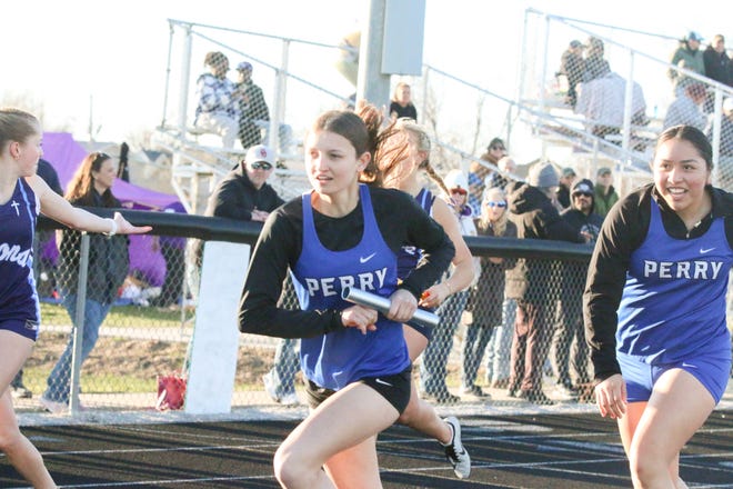 A Perry runner competes during the Cavanaugh Relays on Thursday, April 4, 2024, at Hawk Stadium in Woodward.