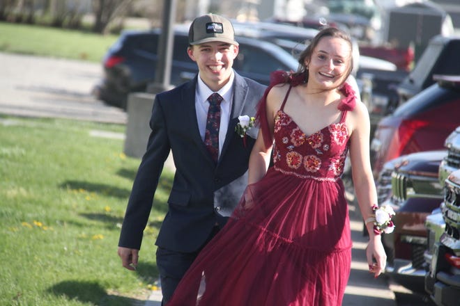 Sterling Parkinson and Maya Martin arrive for the prom grand march on Saturday, April 22, 2023, in the Woodward-Granger High School gym.