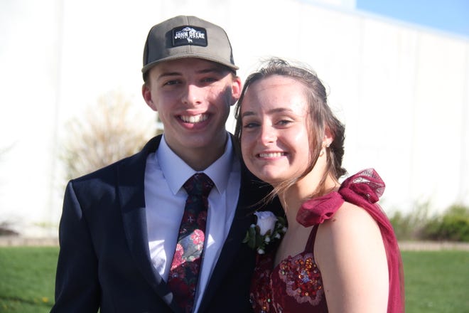 Sterling Parkinson and Maya Martin pose for a photo before the start the prom grand march on Saturday, April 22, 2023, in the Woodward-Granger High School gym.