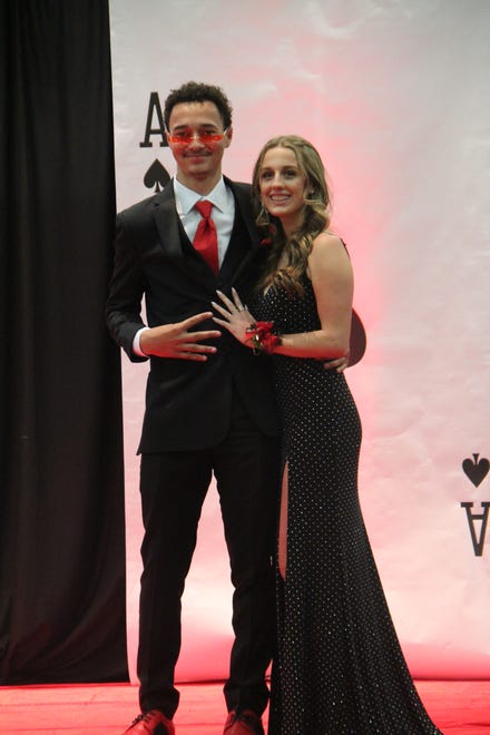 Cooper Thielen and Georgia Simmons pose for photos during the prom grand march on Friday, April 19, 2024, in the Woodward-Granger High School gym.