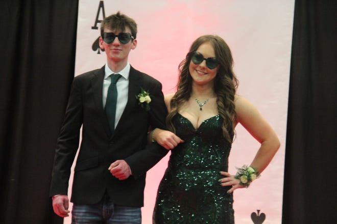 Jarrett Stucker and Bre Hare pose for photos during the prom grand march on Friday, April 19, 2024, in the Woodward-Granger High School gym.