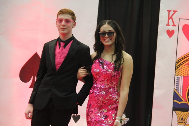 James Flugge-Smith and Brinna Orr pose for photos during the prom grand march on Friday, April 19, 2024, in the Woodward-Granger High School gym.