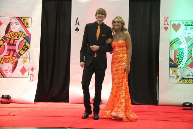 Dillon Limoges and Zara Bejarno pose for photos during the prom grand march on Friday, April 19, 2024, in the Woodward-Granger High School gym.
