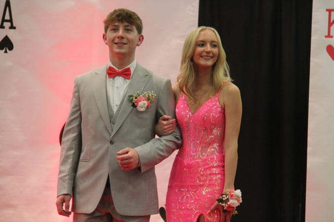 Jaden Schmitt and Ally Brockus pose for photos during the prom grand march on Friday, April 19, 2024, in the Woodward-Granger High School gym.