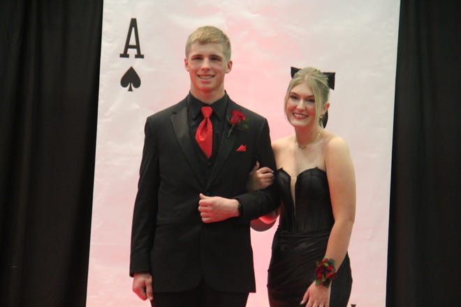 Blake Tuel and Molly Cue pose for photos during the prom grand march on Friday, April 19, 2024, in the Woodward-Granger High School gym.