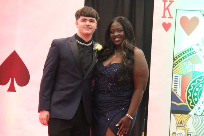 Kaiden Wendt and Rayan Musa pose for photos during the prom grand march on Friday, April 19, 2024, in the Woodward-Granger High School gym.