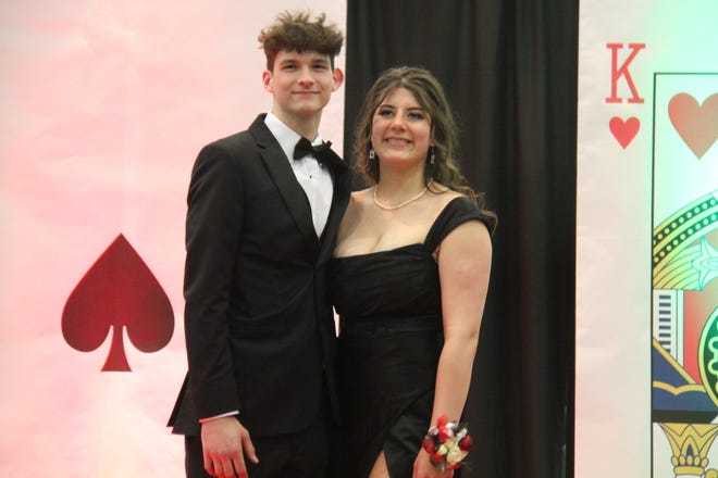 Kainen Schirman and Faith Rasmussen pose for photos during the prom grand march on Friday, April 19, 2024, in the Woodward-Granger High School gym.