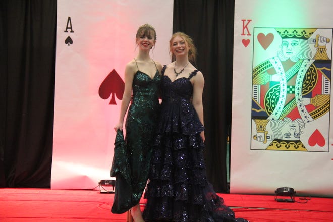 Nikki Halferty and Avery Smith pose for photos during the prom grand march on Friday, April 19, 2024, in the Woodward-Granger High School gym.