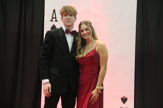 Chandler Drake and Sophie Smith pose for photos during the prom grand march on Friday, April 19, 2024, in the Woodward-Granger High School gym.