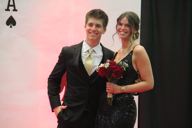 CJ Petersen and Gretta Yingst pose for photos during the prom grand march on Friday, April 19, 2024, in the Woodward-Granger High School gym.