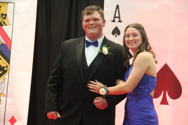 Tabor Lettow and Lexi Bogardus pose for photos during the prom grand march on Friday, April 19, 2024, in the Woodward-Granger High School gym.