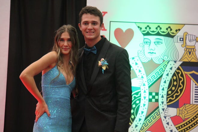 Bryce Polich and Karissa Walker pose for photos during the prom grand march on Friday, April 19, 2024, in the Woodward-Granger High School gym.