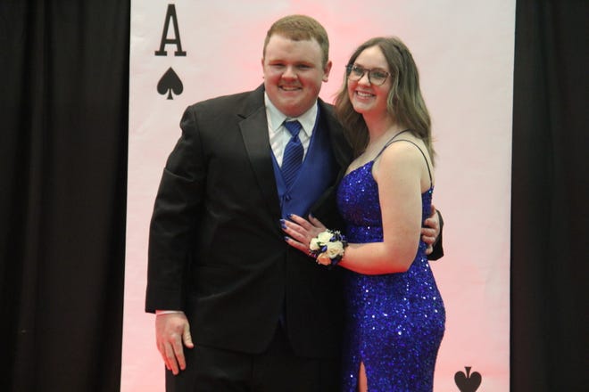 Brock Tiernan and Trinity Handy pose for photos during the prom grand march on Friday, April 19, 2024, in the Woodward-Granger High School gym.