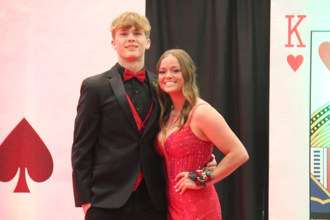 Cael Godwin and Lauren Rodgers pose for photos during the prom grand march on Friday, April 19, 2024, in the Woodward-Granger High School gym.