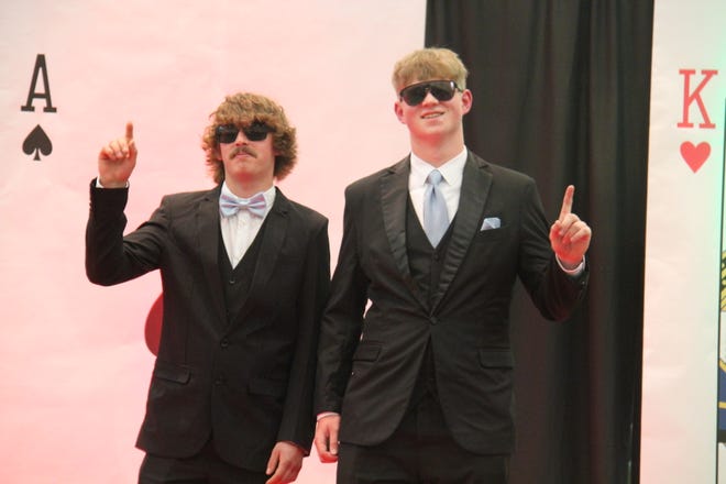 In no order, Brady Bennethum and Holden Heard pose for photos during the prom grand march on Friday, April 19, 2024, in the Woodward-Granger High School gym.