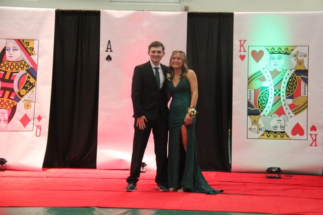 Grant Polito and Macy Behrens pose for photos during the prom grand march on Friday, April 19, 2024, in the Woodward-Granger High School gym.