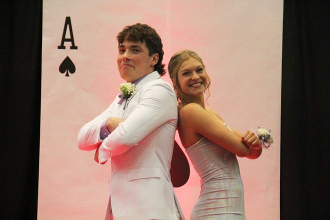 Max Dalton and Jaidyn Achenbach pose for photos during the prom grand march on Friday, April 19, 2024, in the Woodward-Granger High School gym.