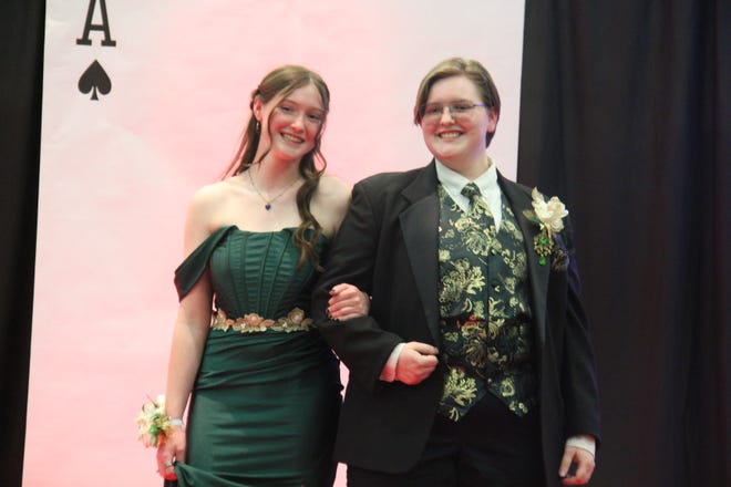 In no order, Devon Hanson and Arabelle Hanson pose for photos during the prom grand march on Friday, April 19, 2024, in the Woodward-Granger High School gym.