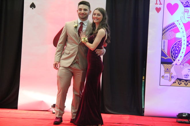 Tanner Ramsey and Libby Grell pose for photos during the prom grand march on Friday, April 19, 2024, in the Woodward-Granger High School gym.