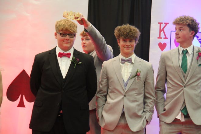 Kaden Seeman, the 2023 prom king, gets set to crown the 2024 king during the grand march on Friday, April 19 in the Woodward-Granger High School gym.