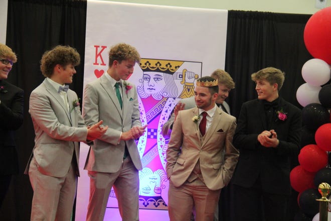 Tanner Ramsey reacts after being crowned the 2024 Woodward-Granger Prom King during grand march on Friday, April 19.