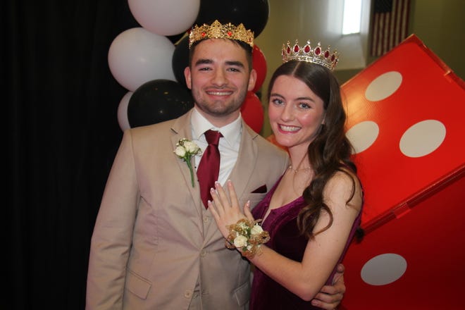 Tanner Ramsey and Libby Grell pose for photos after being crowned the 2024 Woodward-Granger Prom King and Queen during grand march on Friday, April 19.