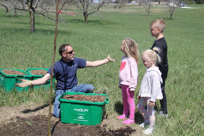 Andy Schmitz, director of horticulture at The Brenton Arboretum, talks about how to plant trees during an Earth Day Celebration on Sunday, April 21, 2024, near Dallas Center.