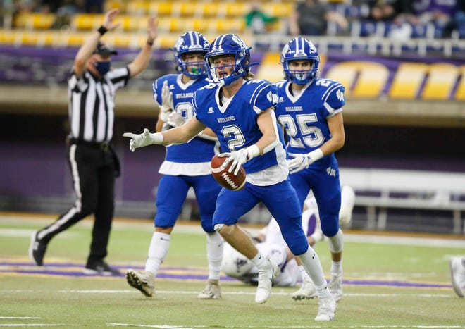 Van Meter senior safety Alex Jones celebrates after pulling down an interception in the third quarter against South Central Calhoun in their Class 1A game at the UNI-Dome in Cedar Falls on Saturday, Nov. 14, 2020.