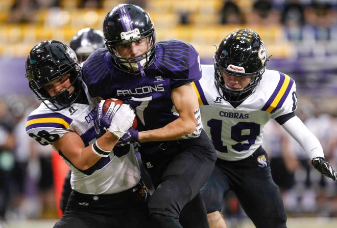 OABCIG senior wide receiver Cameron Sharkey powers through Sigourney-Keota's Cole Clarhan for a first down in the first quarter of their Class 1A game at the UNI-Dome in Cedar Falls on Saturday, Nov. 14, 2020.