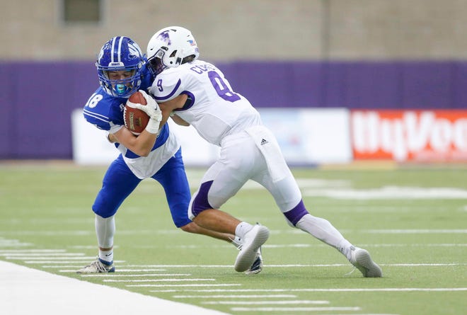 South Central Calhoun senior safety Cole Corey hits Van Meter receiver Maddox Artzer out of bounds in the second quarter of their game at the UNI-Dome in Cedar Falls on Saturday, Nov. 14, 2020.