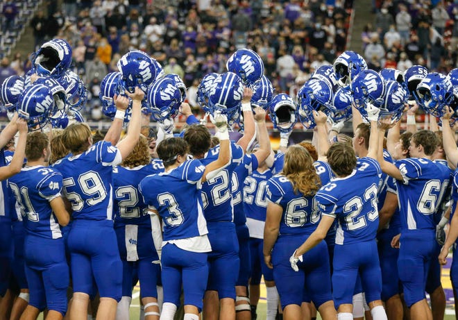 Members of the Van Meter football team celebrate a win over South Central Calhoun in their Class 1A game at the UNI-Dome in Cedar Falls on Saturday, Nov. 14, 2020.