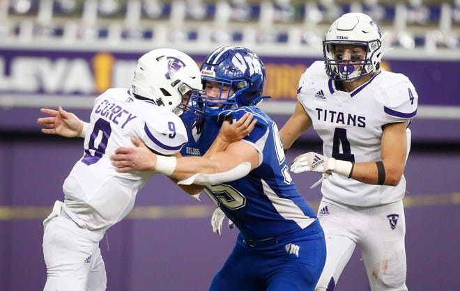 Van Meter junior defensive end Lincoln Olsen hits South Central Calhoun quarterback Cole Corey for a loss in the third quarter of their Class 1A game at the UNI-Dome in Cedar Falls on Saturday, Nov. 14, 2020.