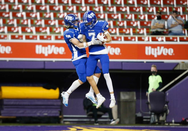Van Meter junior receiver Ganon Archer (No. 7) celebrates with tight end Calvin Sieck after pulling down a touchdown catch in the fourth quarter against South Central Calhoun in their Class 1A game at the UNI-Dome in Cedar Falls on Saturday, Nov. 14, 2020.