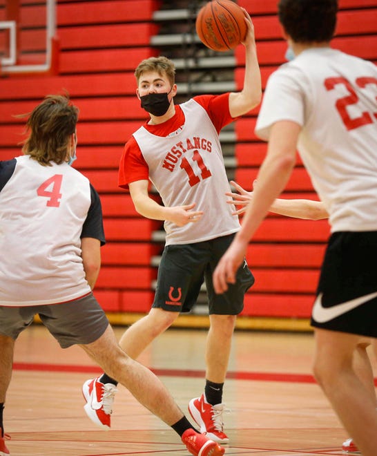 Dallas Center-Grimes senior guard Luke Rankin fires a pass during a practice drill at Dallas Center-Grimes High School in Grimes on Wednesday, Jan. 7, 2021.