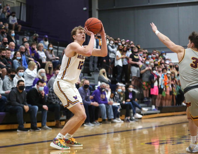 Waukee senior guard Tucker DeVries lines up a shot from three point range in the first quarter against Ankeny during the Class 4A regional final on Tuesday, March 2, 2021.