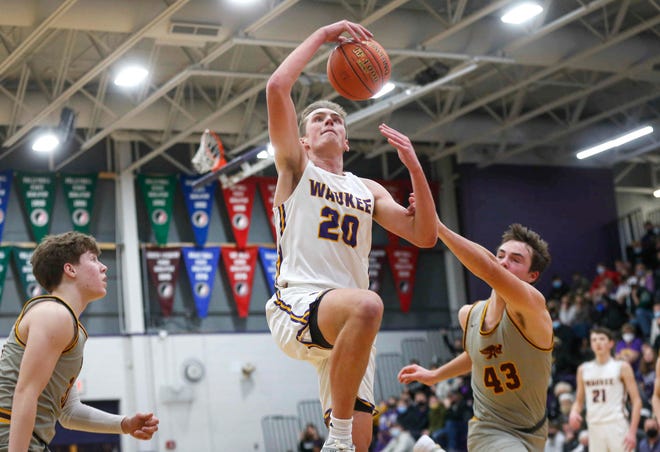 Waukee senior forward Payton Sandfort is fouled by Ankeny sophomore Karson Wehde in the fourth quarter during the Class 4A regional final on Tuesday, March 2, 2021.