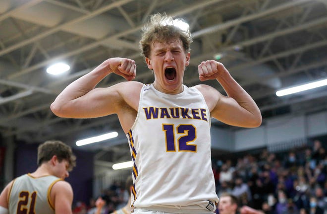 Waukee senior guard Tucker DeVries flexes after hitting a field goal and drawing a foul in the third quarter against Ankeny during the Class 4A regional final on Tuesday, March 2, 2021.