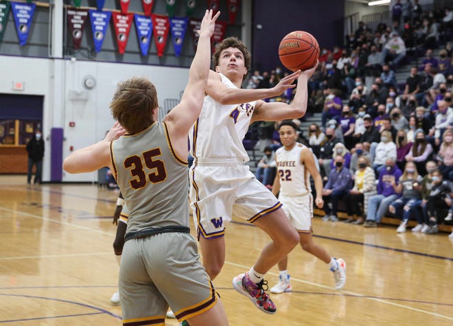 Waukee sophomore guard Cade Kelderman runs a shot up to the basket in the fourth quarter against Ankeny during the Class 4A regional final on Tuesday, March 2, 2021.