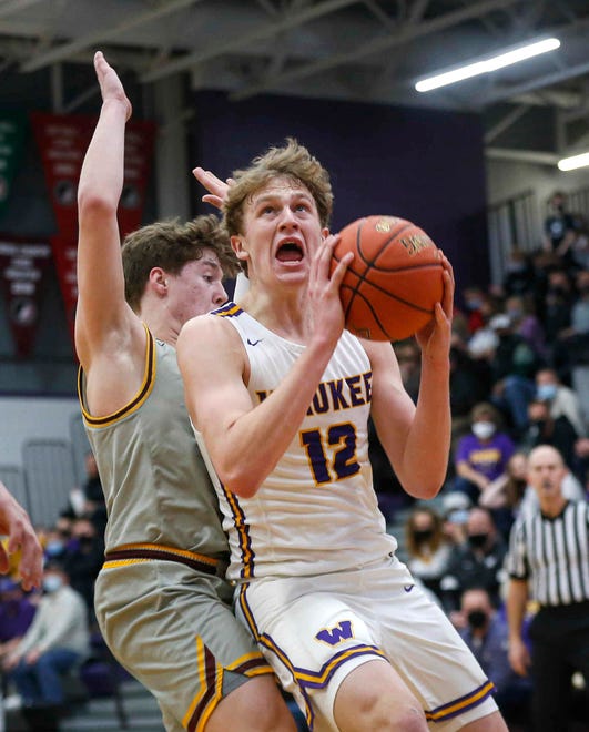 Waukee senior guard Tucker DeVries drives to the basket in the first quarter against Ankeny in the third quarter against Ankeny during the Class 4A regional final on Tuesday, March 2, 2021.