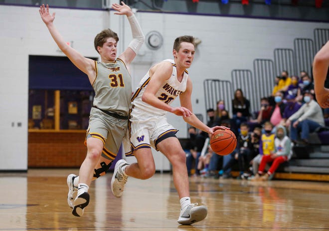 Waukee senior forward Payton Sandfort moves the ball up court in the fourth quarter against Ankeny during the Class 4A regional final on Tuesday, March 2, 2021.