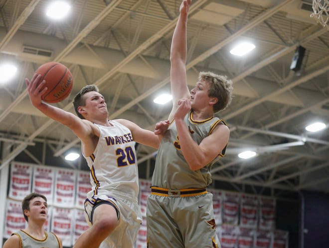 Waukee senior forward Payton Sandfort drives up a shot in the first quarter against Ankeny during the Class 4A regional final on Tuesday, March 2, 2021.