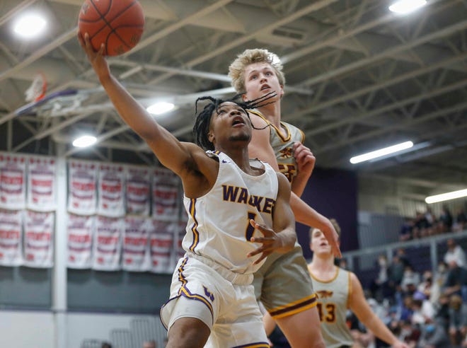Waukee senior guard Malik Allen cruises to the basket for a layup in the first quarter against Ankeny during the Class 4A regional final on Tuesday, March 2, 2021.