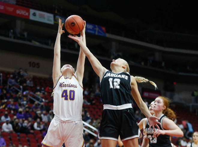 Waukee junior forward Camryn Weers, left, reaches for a rebound as Ankeny Centennial junior Olivia Anderson reaches to knock it away in the first quarter on Thursday, March 4, 2021, during the Iowa high school girls state basketball tournament at Wells Fargo Arena in Des Moines.
