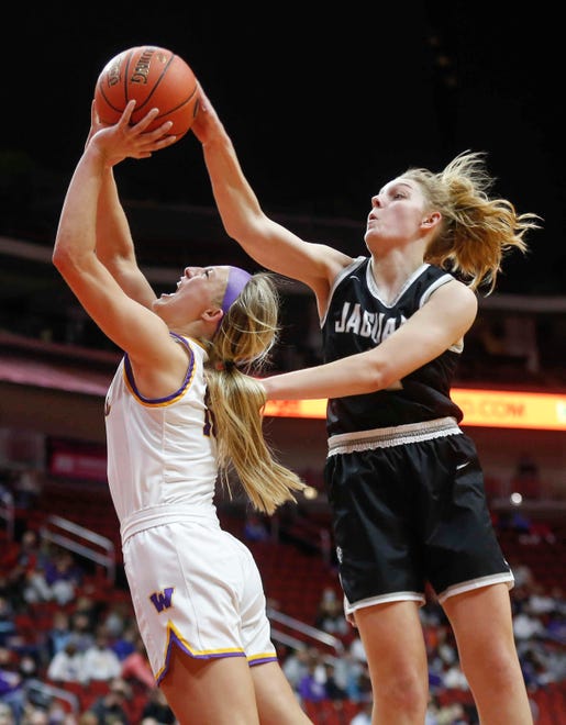 Waukee senior guard Katie Dinnebier, left, drives to the basket as Ankeny Centennial's Bella Robben swats the ball away in the fourth quarter on Thursday, March 4, 2021, during the Iowa high school girls state basketball tournament at Wells Fargo Arena in Des Moines.
