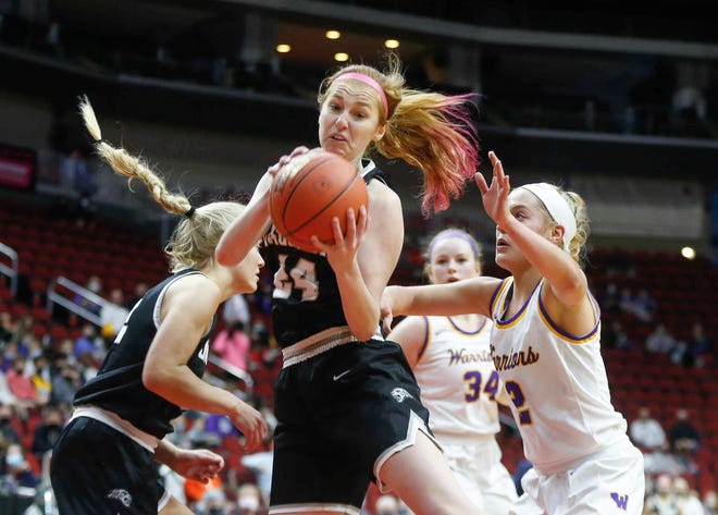 Ankeny Centennial senior  Lizzie Strom pulls down a defensive rebound in the third quarter against Waukee on Thursday, March 4, 2021, during the Iowa high school girls state basketball tournament at Wells Fargo Arena in Des Moines.