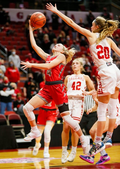Avery Korsching of Dallas Center Grimes drives to the basket as Cassidy Thompson of Ballard defends during the 4A semifinals game Thursday, March 4, 2021.